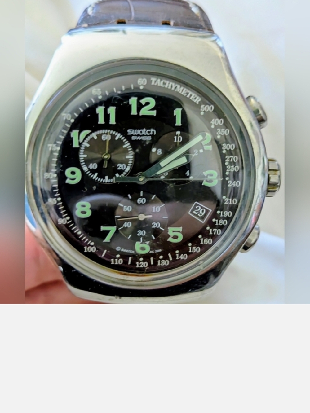 Swatch Silver Case Black Dial Watch with Green Numerals